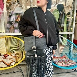 Elegant Black Leather Crossbody Bag with Fringe